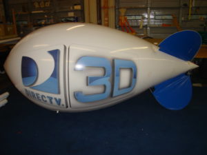 marketing blimp- white color blimp with blue lettering